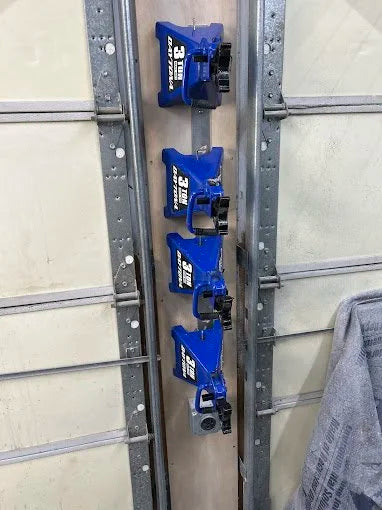 Customer photo using 4Link4WD jack stand hanger to safely store 3 Ton Daytona jack stands between garage doors. 