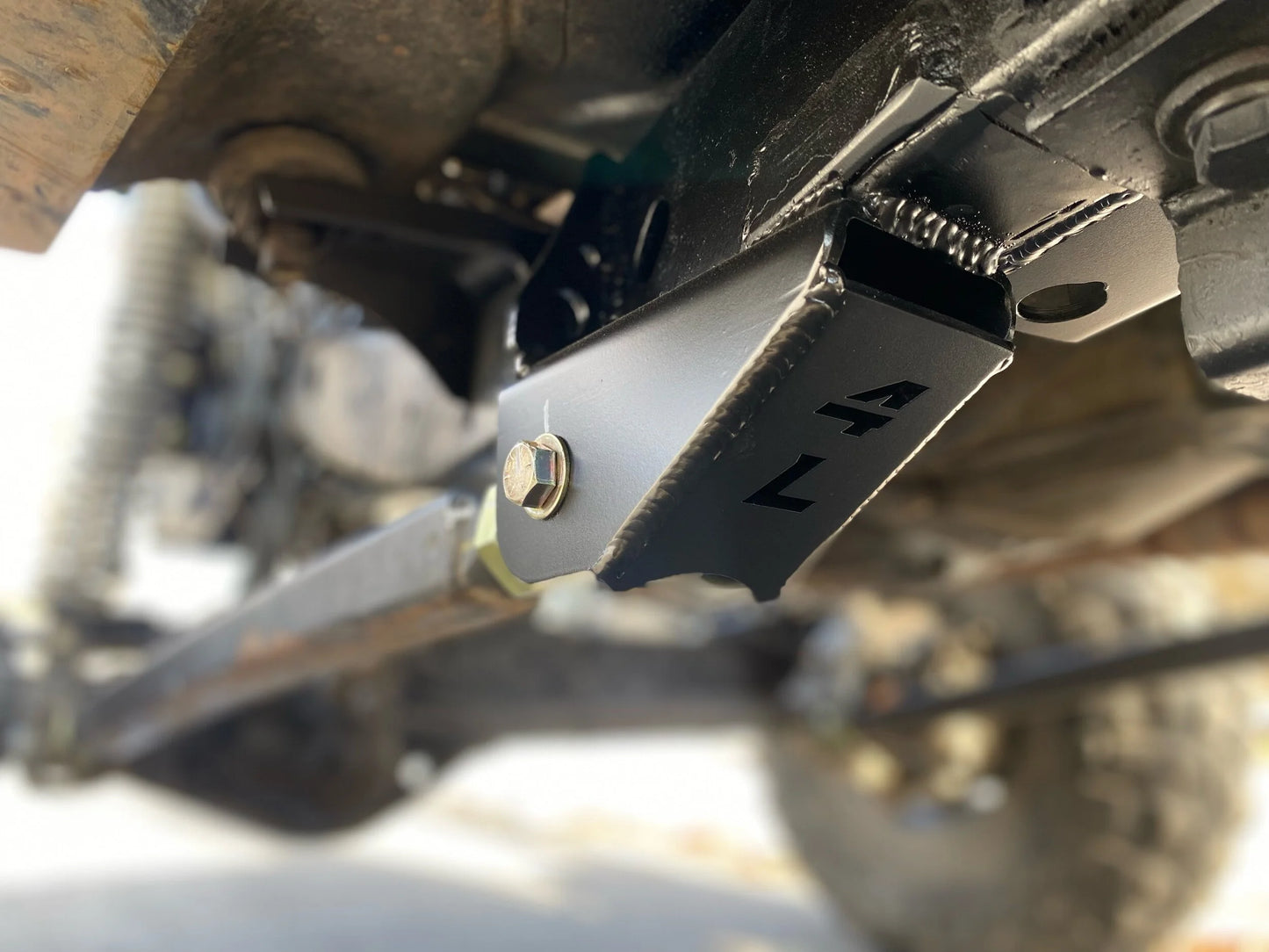 4Link4WD lower control arm frame brackets mounted to Jeep TJ frame in custom long arm set up. 