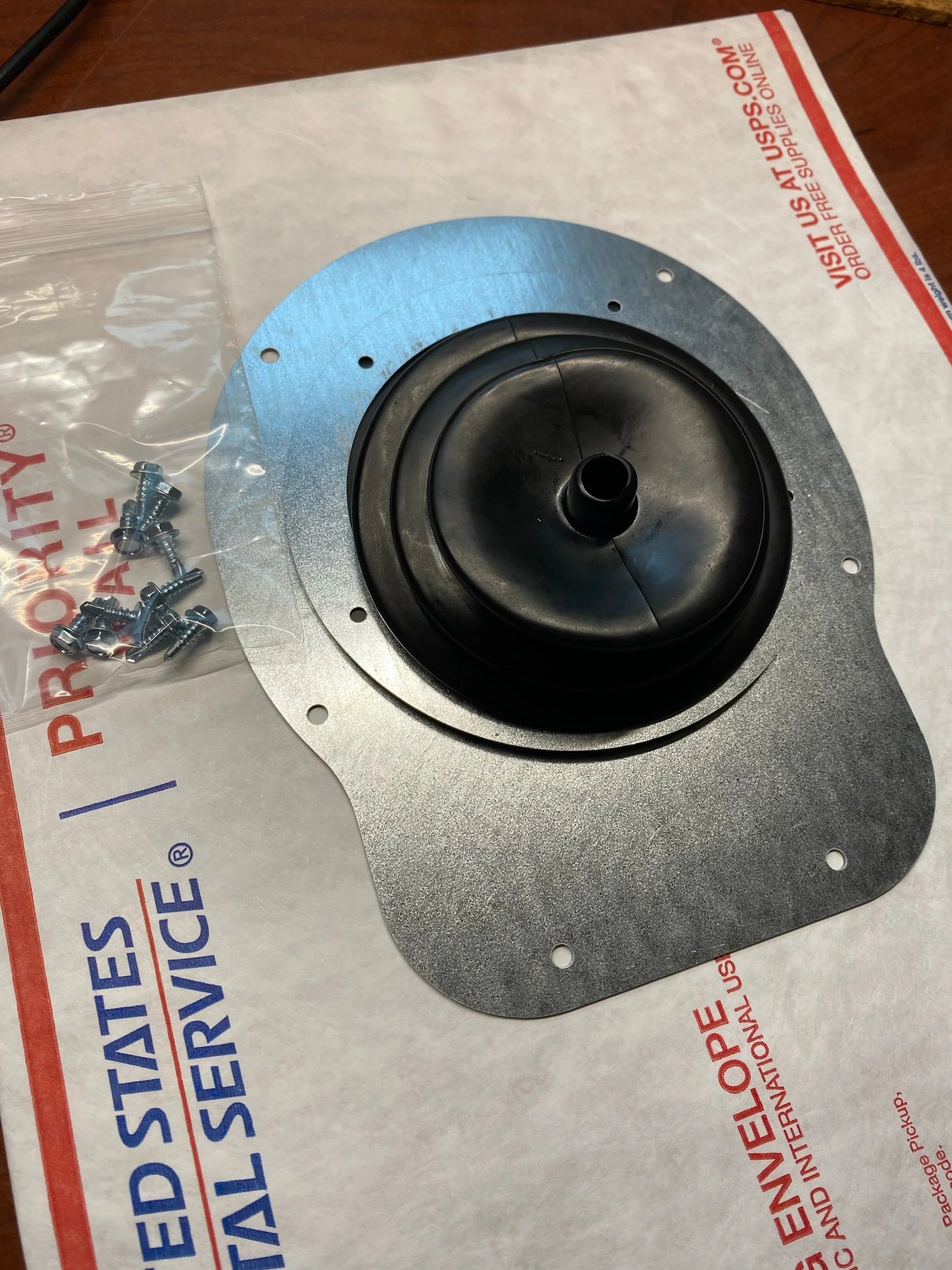 ZJ 5 Speed Dust Boot Kit. Showing supplied hardware and precision laser-cut galvanized steel parts.