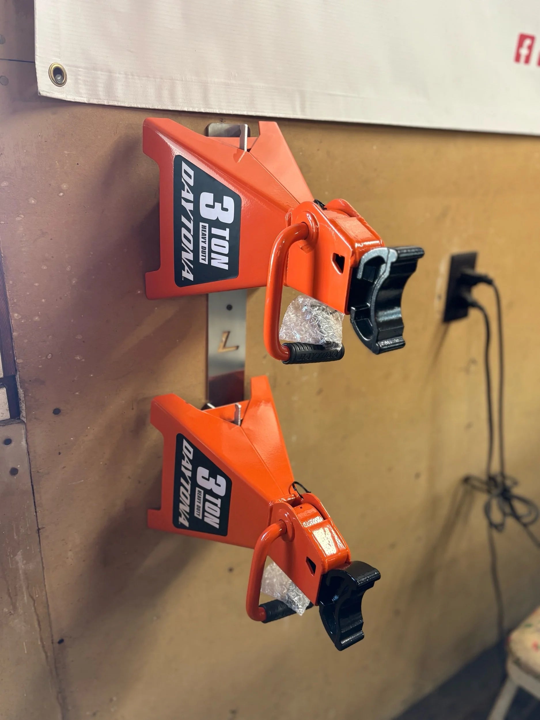 4Link4WD jack stand wall hanger mount holding 3 Ton Daytona jack stands. 