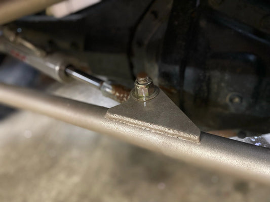 Close up of 4Link4WD hydraulic ram tabs on steel DOM tie rod.