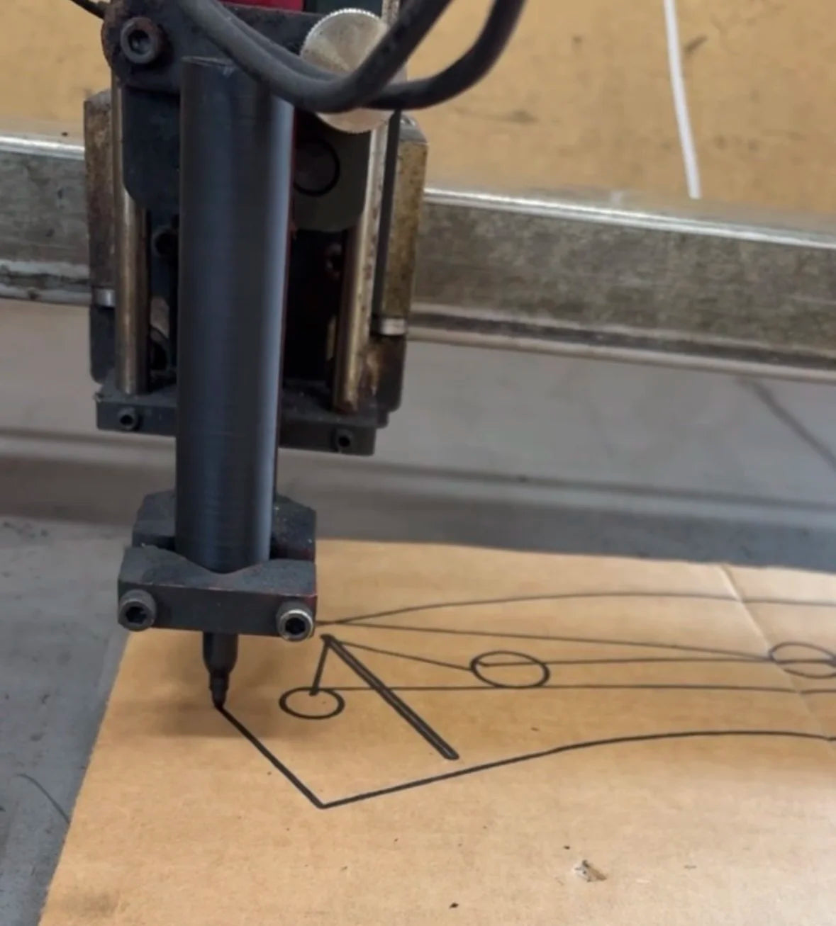 4Link4WD Plasma table marker attachment being used to trace frame stiffener cut profile.