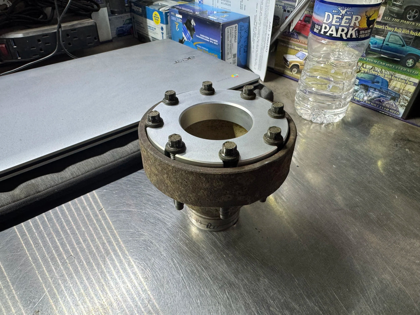 4Link4WD JK / JL pinion spacer shown in place on JK pinion yoke, with factory hardware.