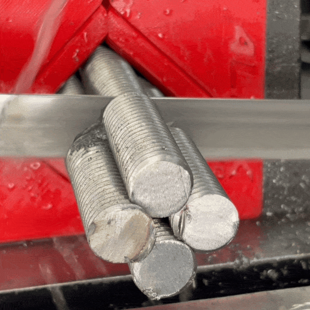 Four threaded rods cut at once in the Bandsaw Grouping Jaw System