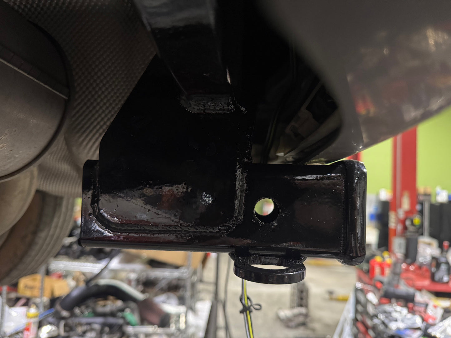 Close up view of fully installed hitch under bumper cover. 